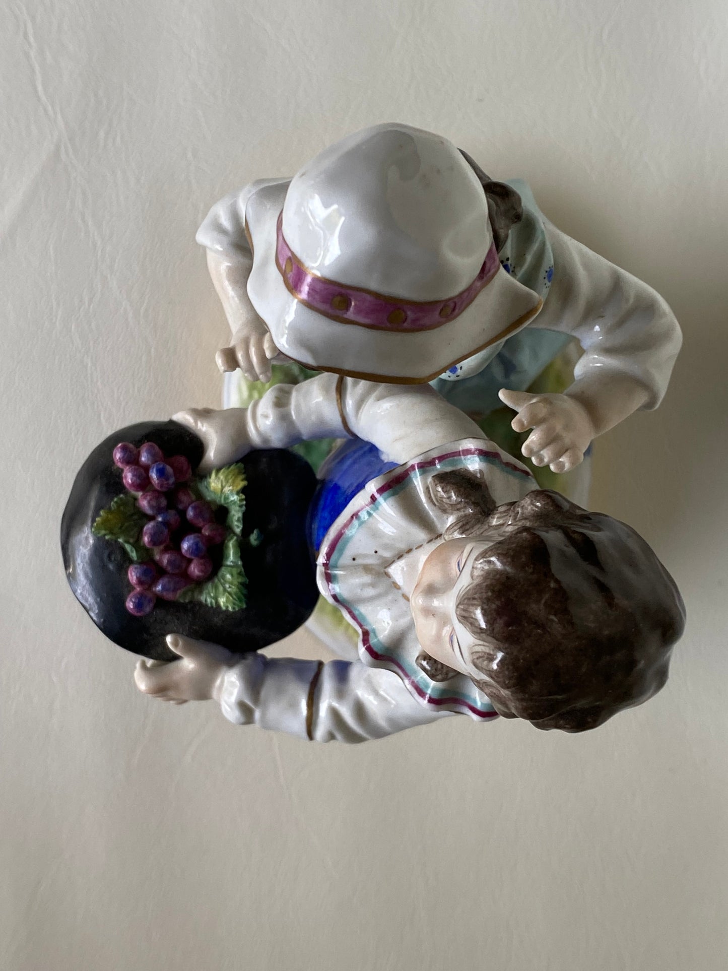 Volkstedt Figurine - Girl and boy harvesting grapes.