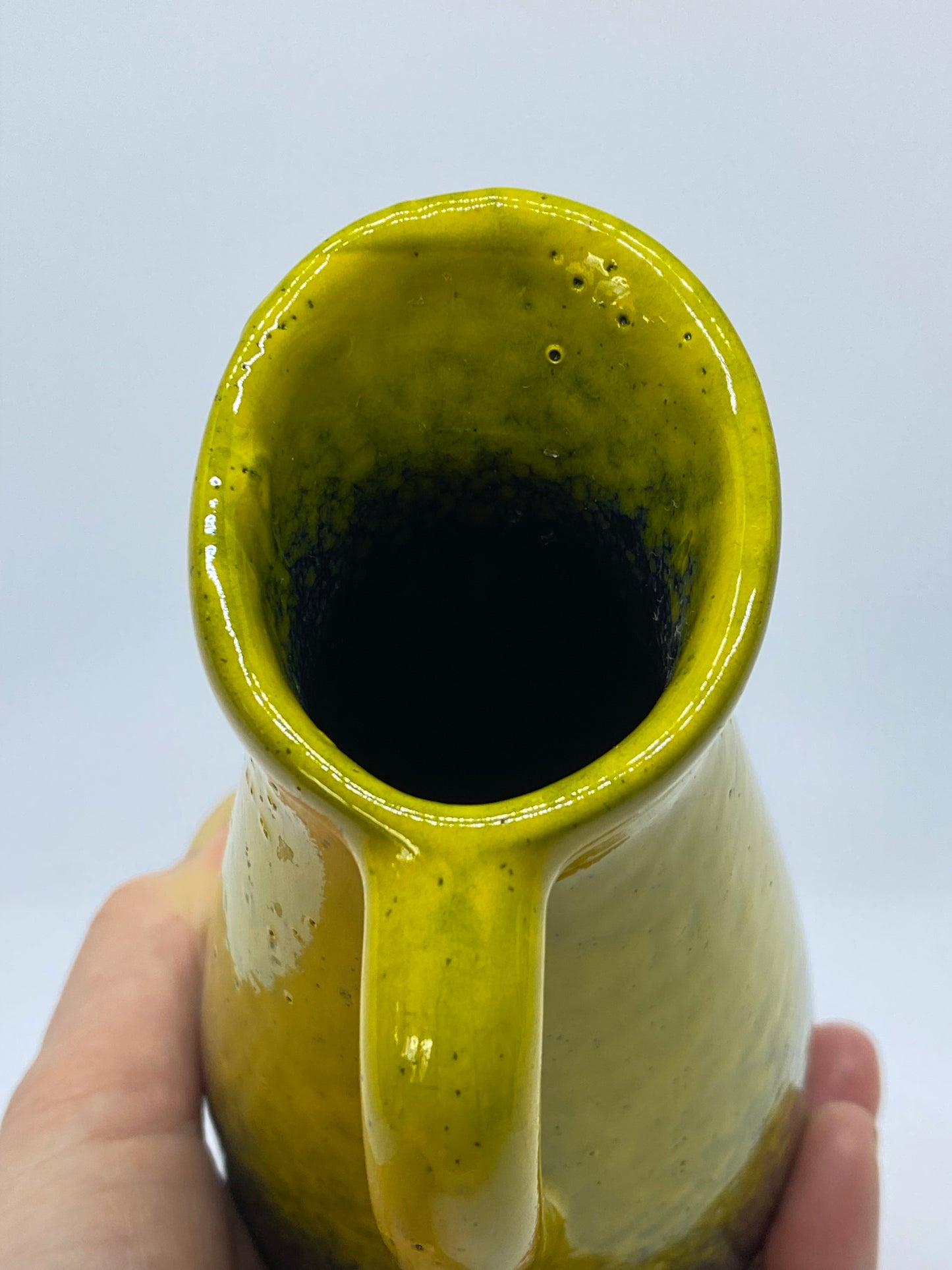 Yellow and black jug