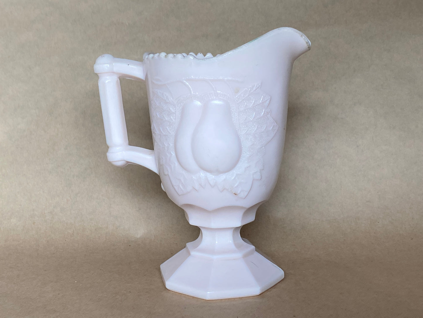Vintage Jeannette Shell Pink Milk Glass Footed Creamer in the Baltimore Pear pattern.