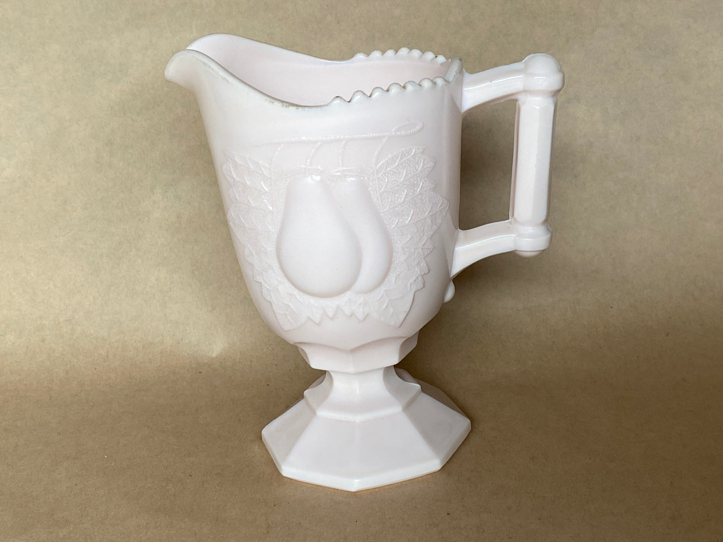 Vintage Jeannette Shell Pink Milk Glass Footed Creamer in the Baltimore Pear pattern.
