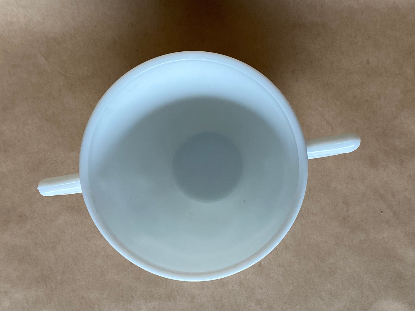 Westmoreland Milk glass creamer with a raised floral or tulip pattern
