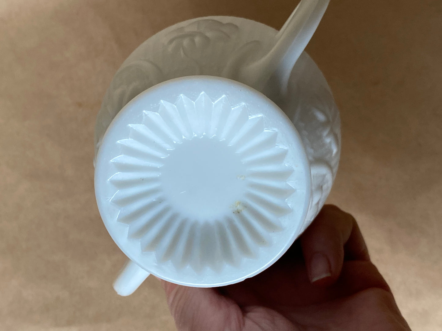 Westmoreland Milk glass creamer with a raised floral or tulip pattern