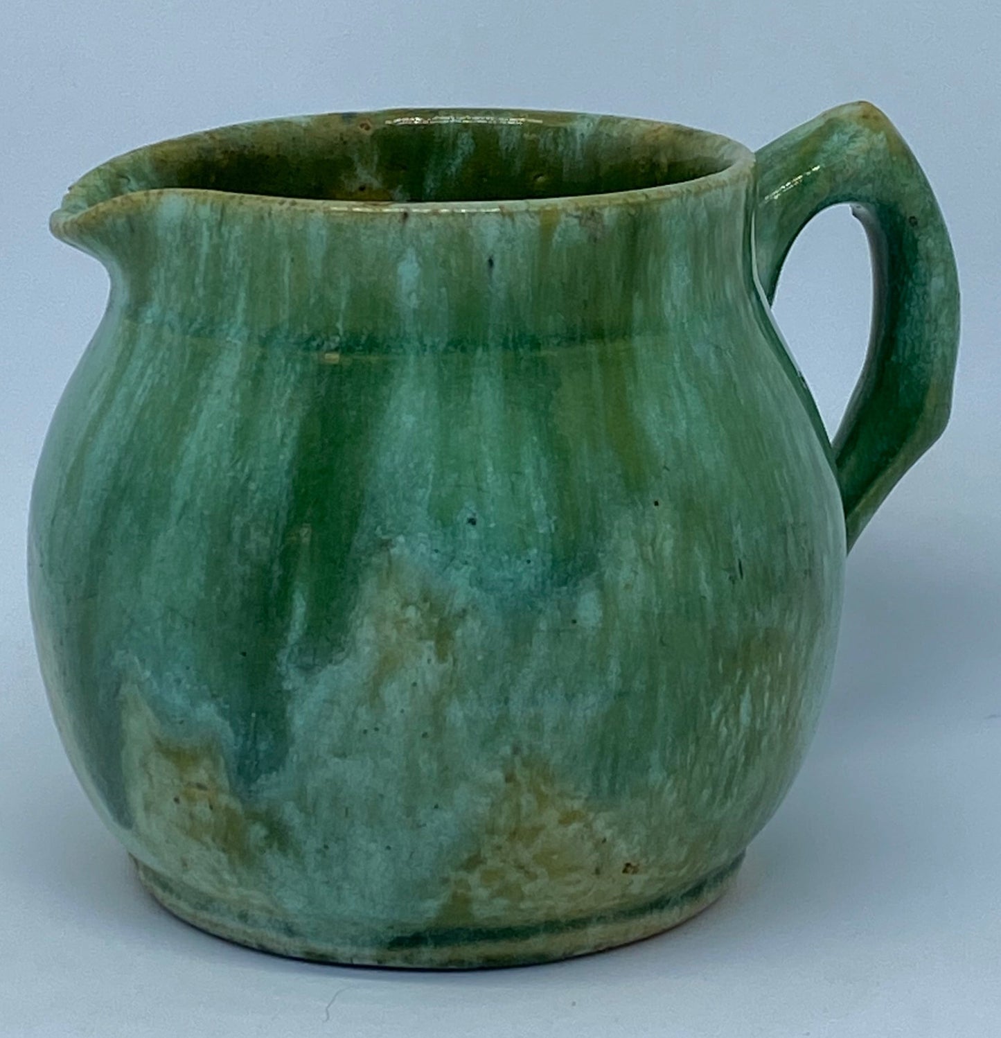Small John Campbell Tasmania green glazed jug Shape incised 42