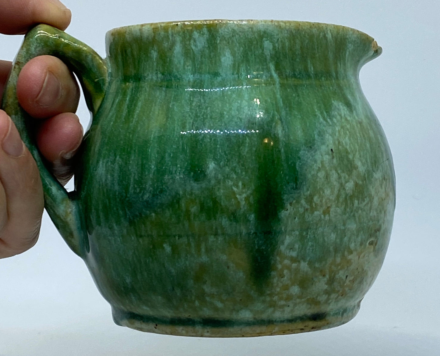 Small John Campbell Tasmania green glazed jug Shape incised 42