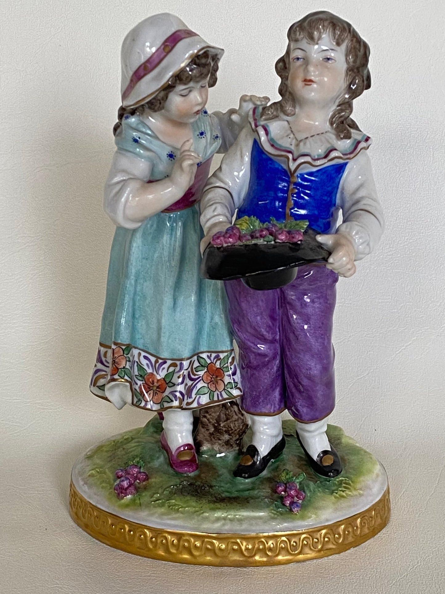 Volkstedt Figurine - Girl and boy harvesting grapes.