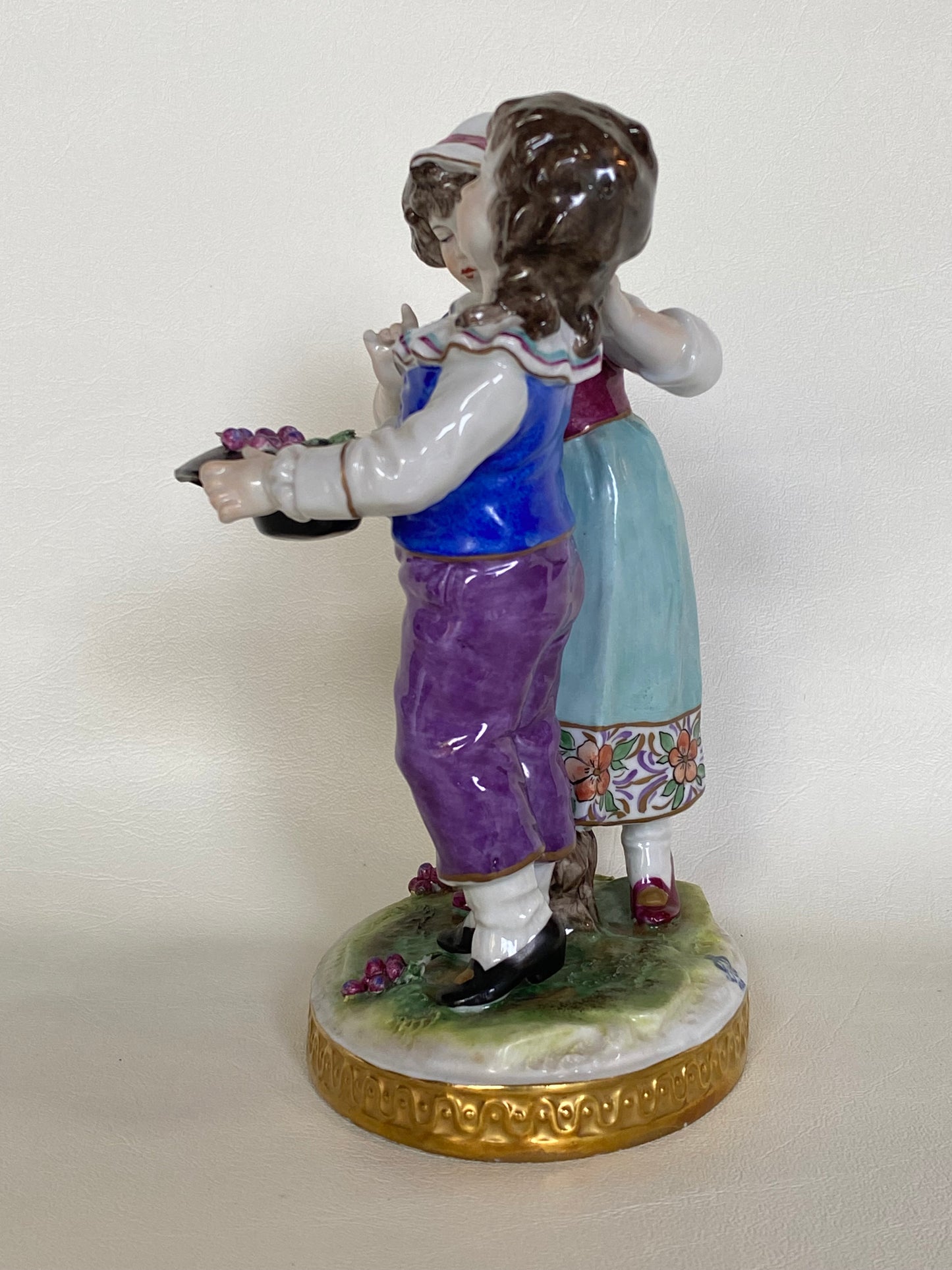 Volkstedt Figurine - Girl and boy harvesting grapes.