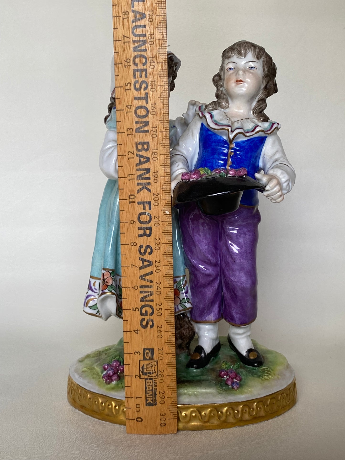 Volkstedt Figurine - Girl and boy harvesting grapes.