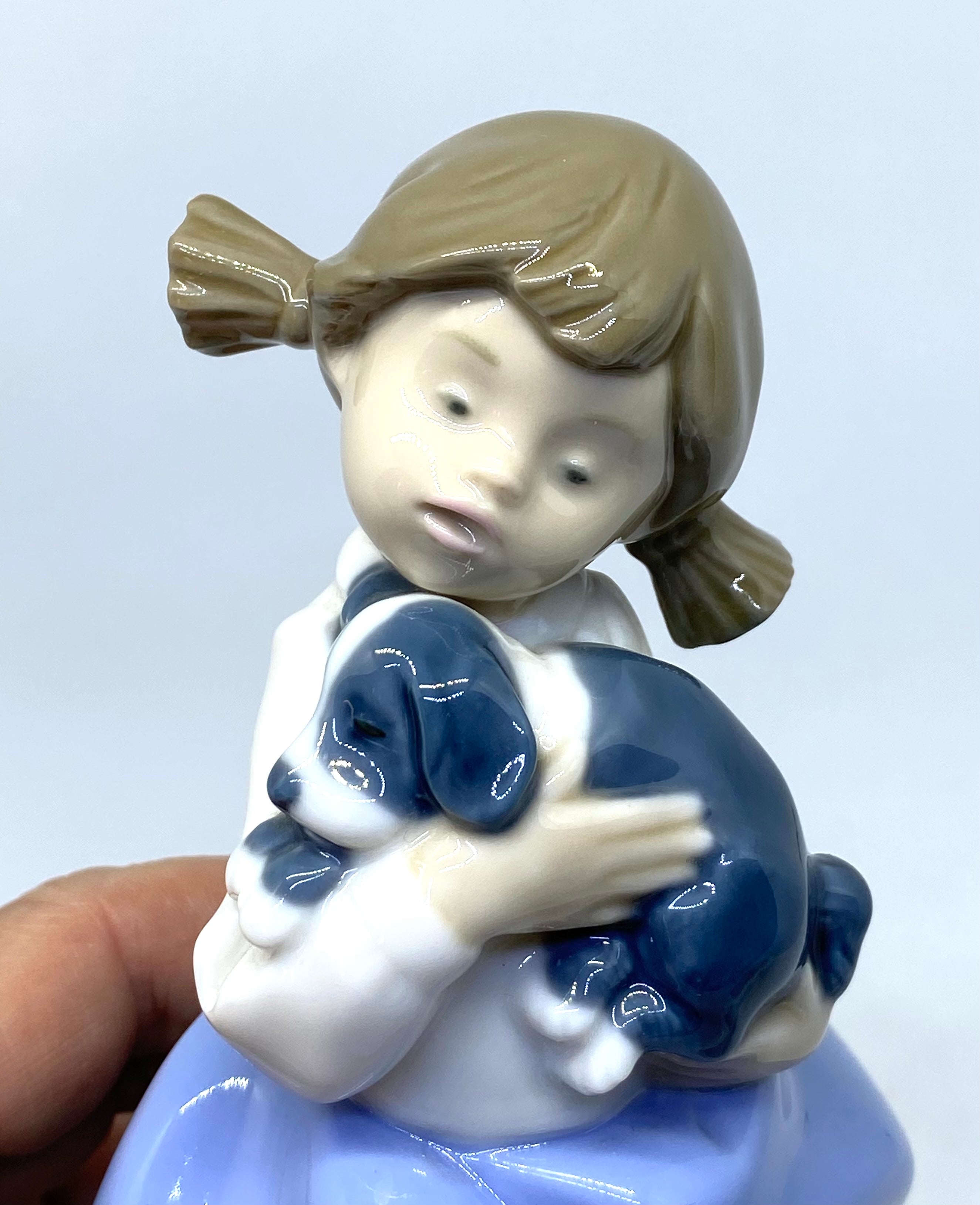 NAO by Lladró - Girl 'Daisa' Holding Puppy - 1987 - Porcelain