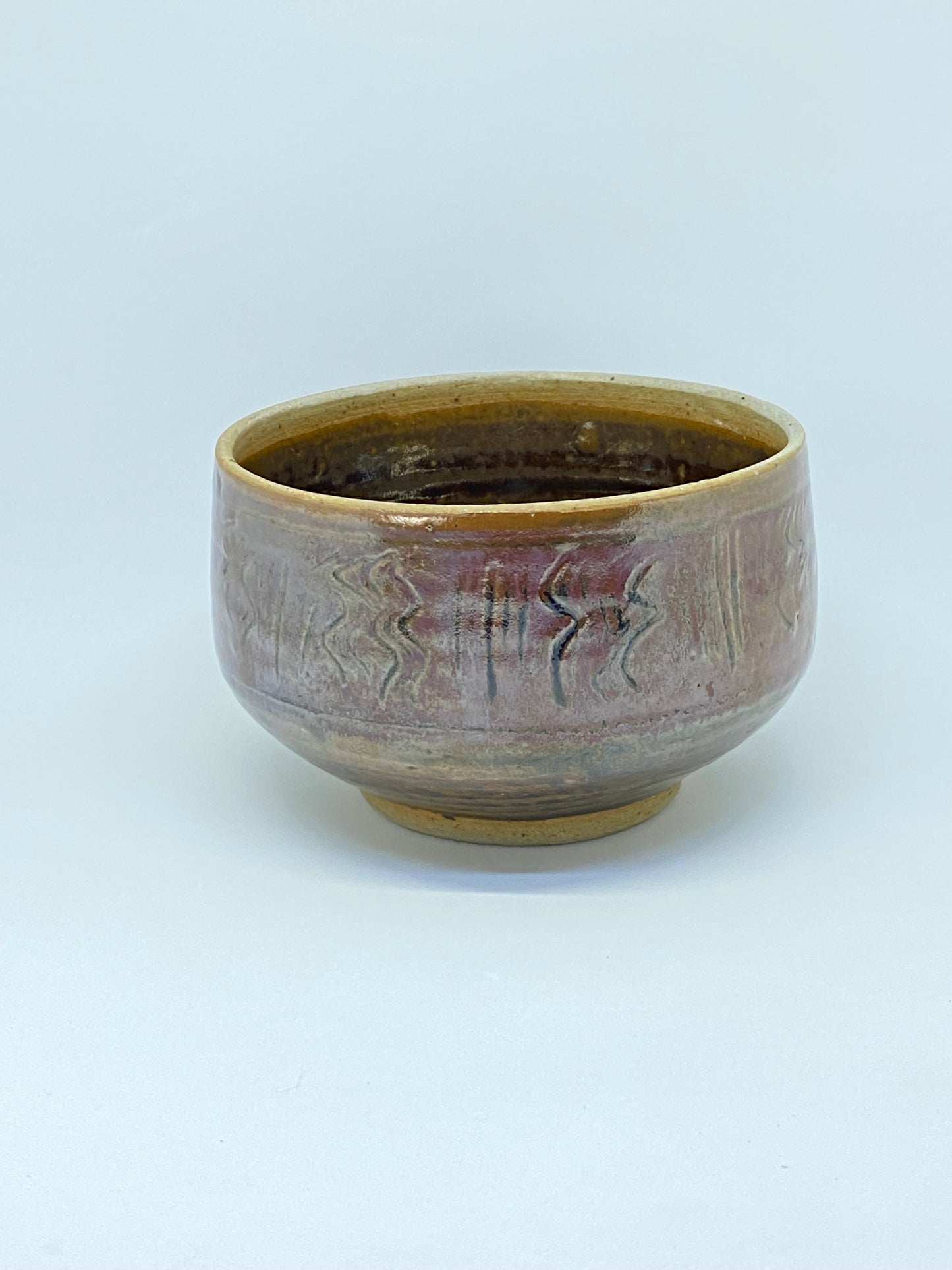 Cynthia Mitchell stoneware bowl with design and awesome glaze
