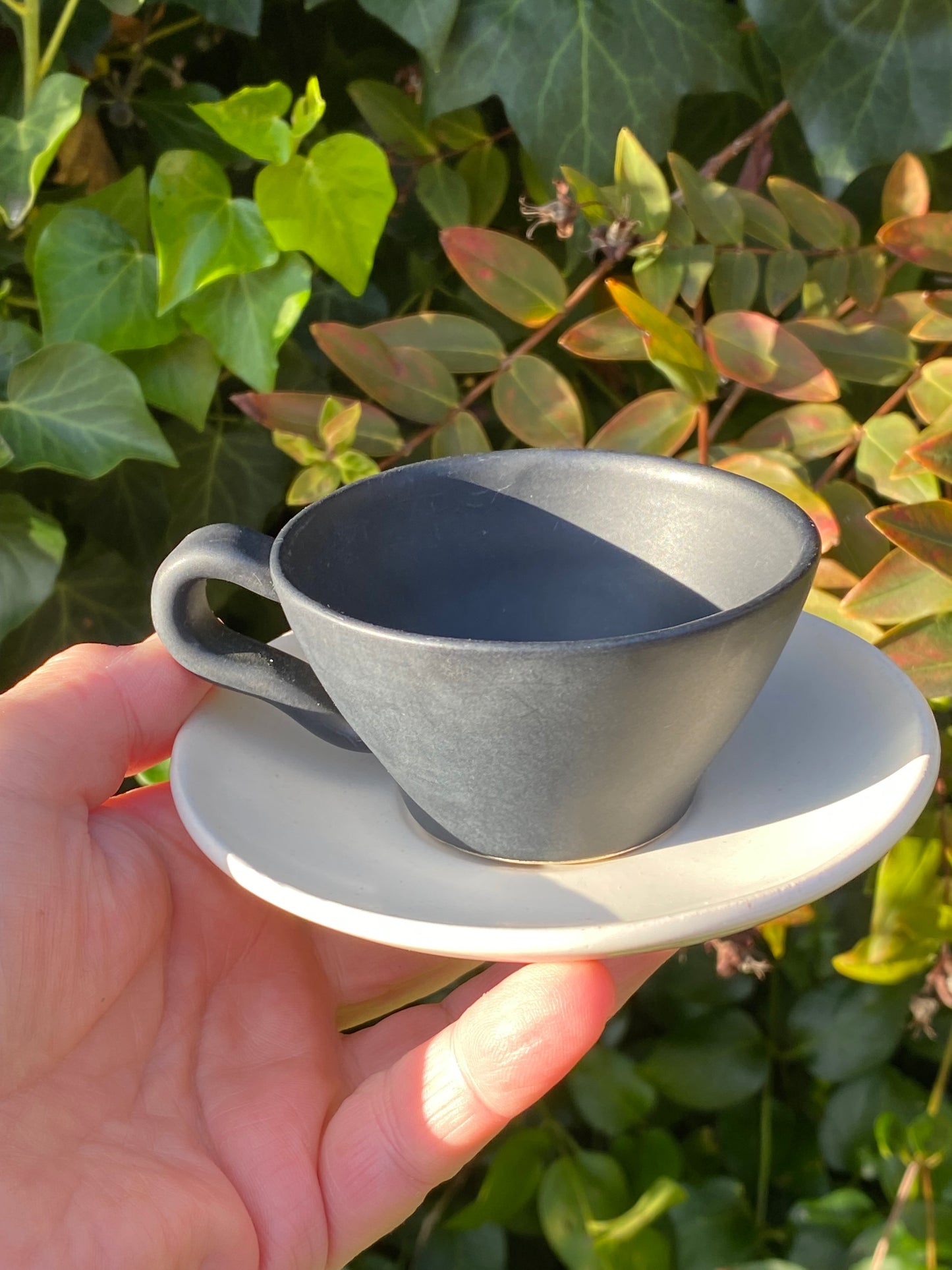 1960s Raynham Australia black and white glazed pottery demitasse cups and saucers