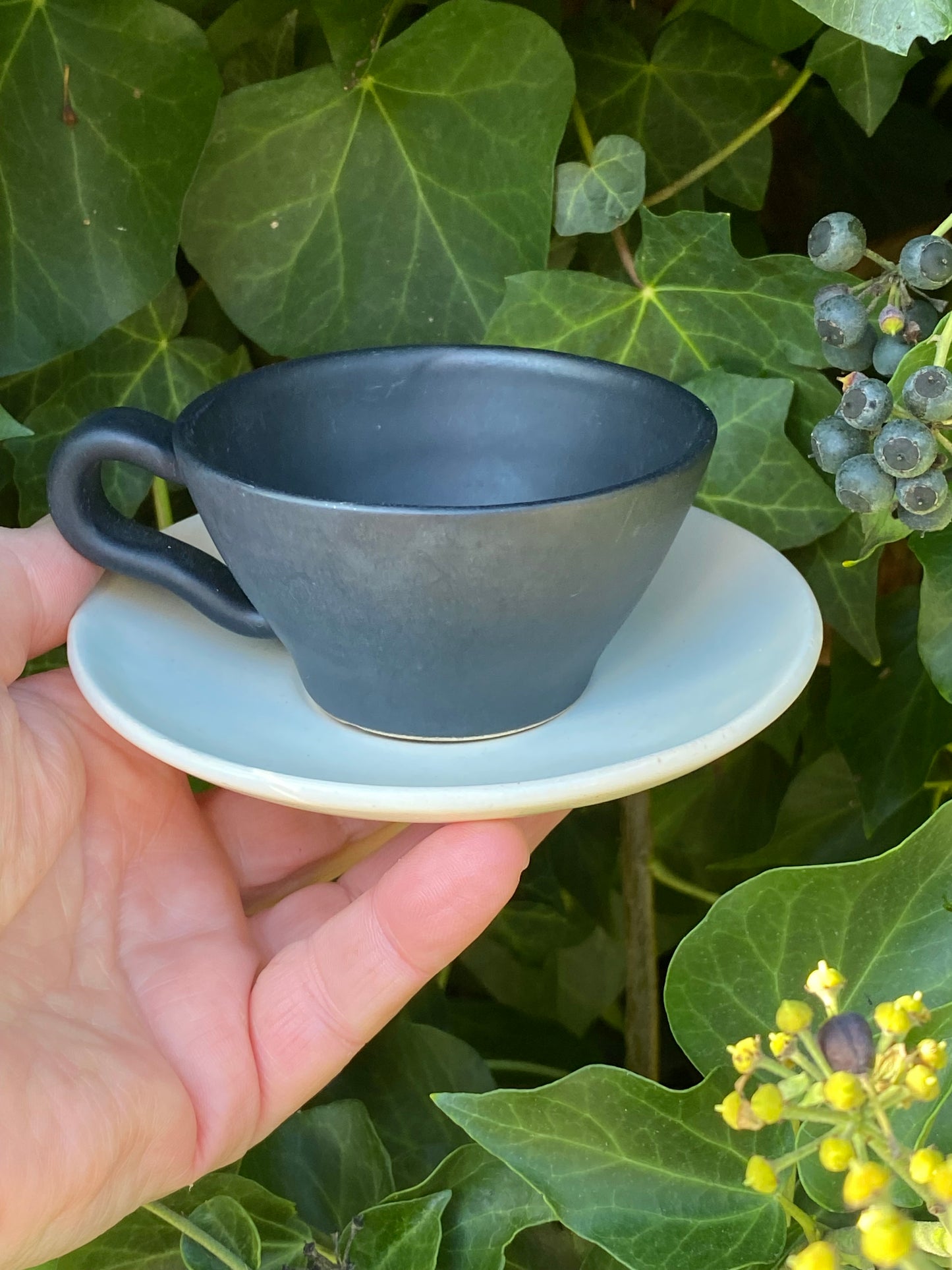 1960s Raynham Australia black and white glazed pottery demitasse cups and saucers