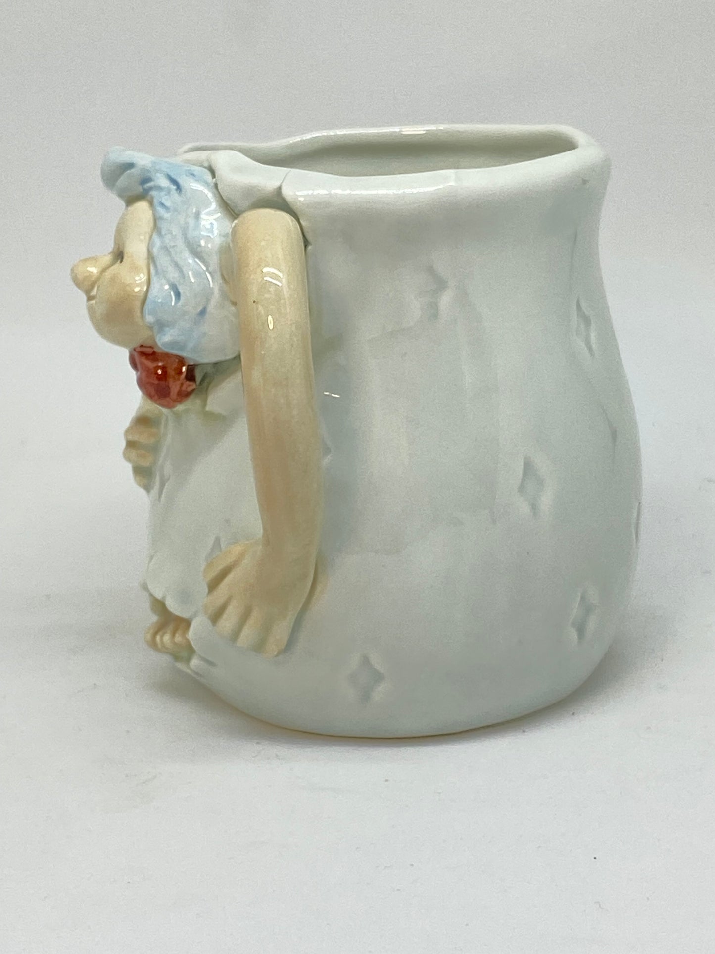 Marks and Rosenthal collectable cup - Man with bow tie escaping the cup