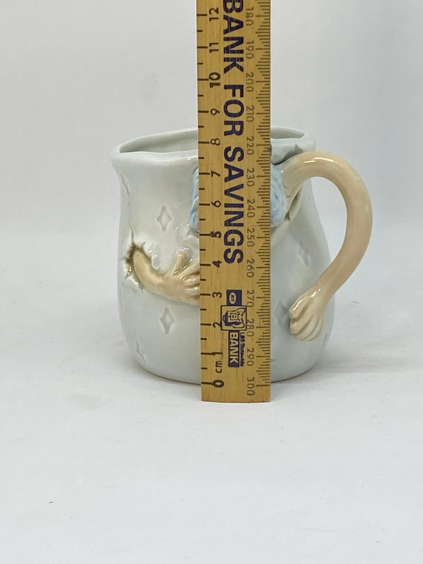 Marks and Rosenthal collectable cup - Man with bow tie escaping the cup